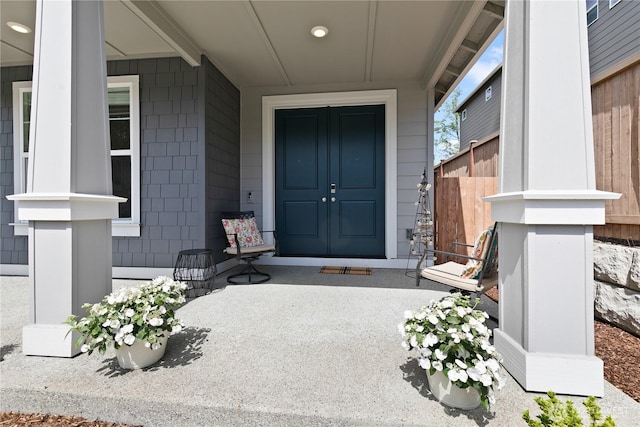 view of exterior entry featuring a porch