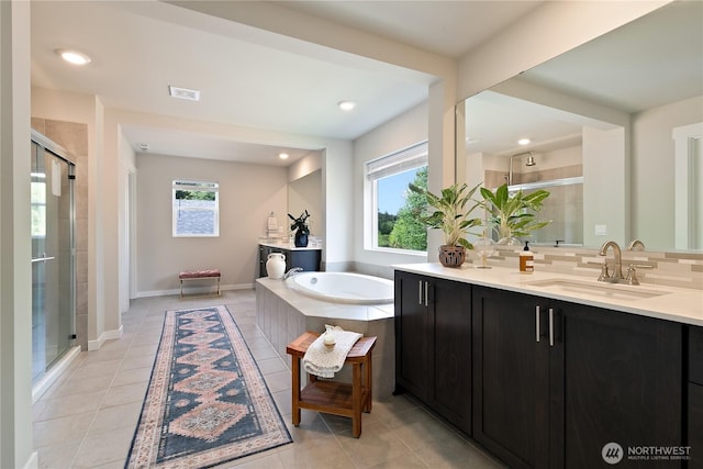 full bathroom featuring vanity, tile patterned floors, a stall shower, and a bath
