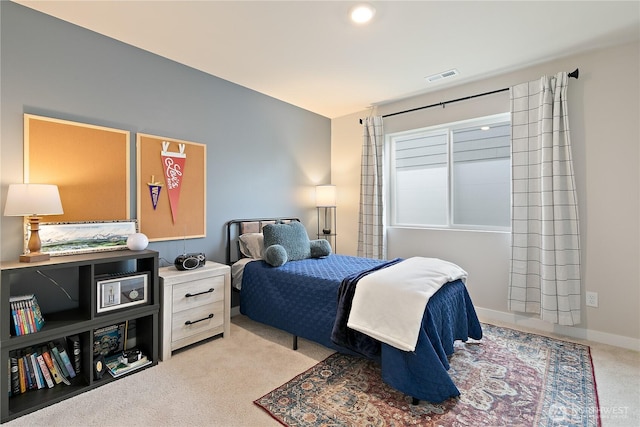 carpeted bedroom with visible vents