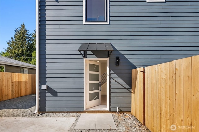 property entrance with fence
