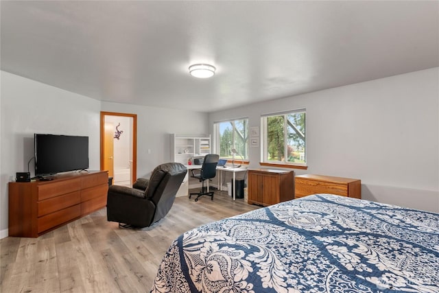 bedroom with light wood finished floors