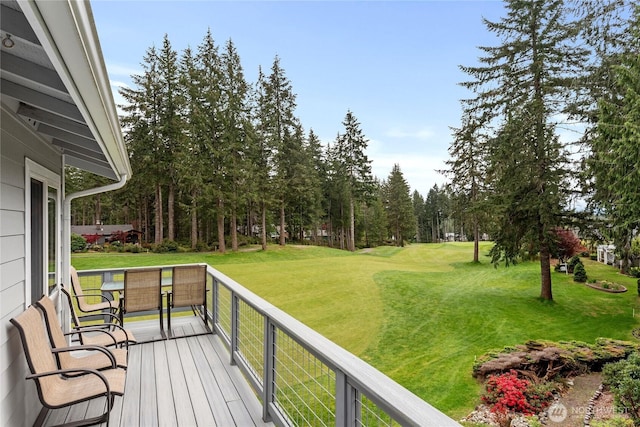wooden deck with a lawn