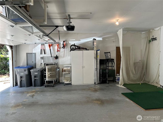 121 E Fir Tree Ln, Union, WA 98592 - garage featuring a garage door opener and electric panel
