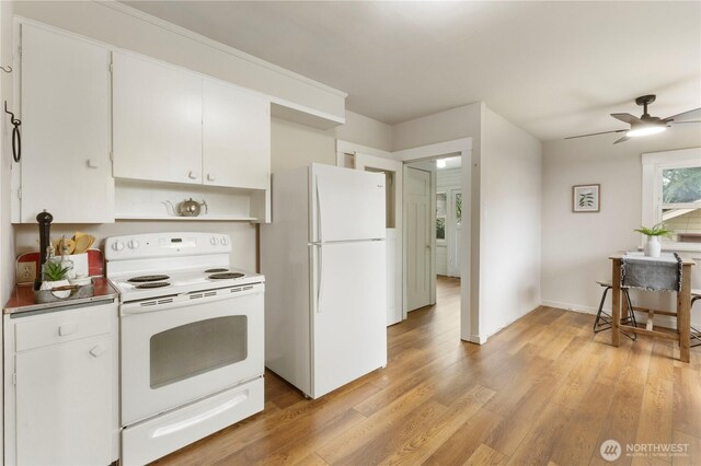 kitchen with white appliances, a ceiling fan, white cabinets, and light wood-style floors