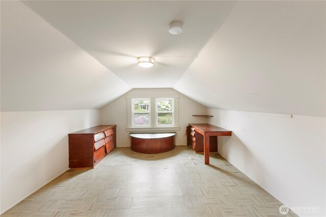 additional living space with lofted ceiling