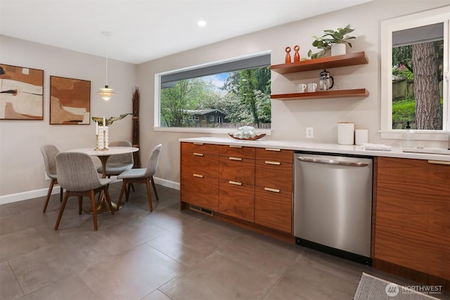 15506 Juanita Dr NE, Kenmore, WA 98028 - kitchen featuring dishwasher, light countertops, brown cabinetry, baseboards, and modern cabinets