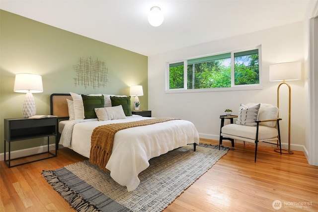 15506 Juanita Dr NE, Kenmore, WA 98028 - bedroom featuring light wood-style floors and baseboards