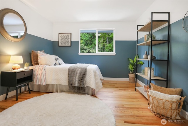 15506 Juanita Dr NE, Kenmore, WA 98028 - bedroom featuring baseboards and wood finished floors