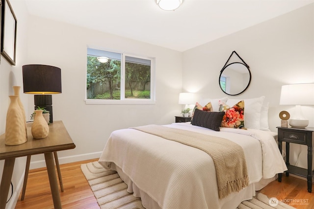 15506 Juanita Dr NE, Kenmore, WA 98028 - bedroom with baseboards and wood finished floors