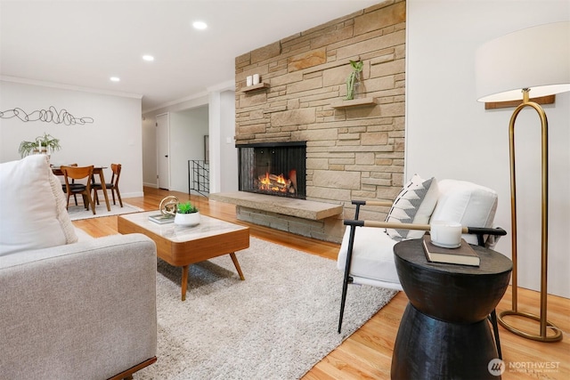 15506 Juanita Dr NE, Kenmore, WA 98028 - living room with recessed lighting, ornamental molding, wood finished floors, and a fireplace