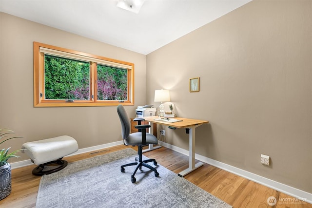 office area featuring baseboards, wood finished floors, and visible vents