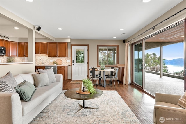 living room featuring recessed lighting and wood finished floors