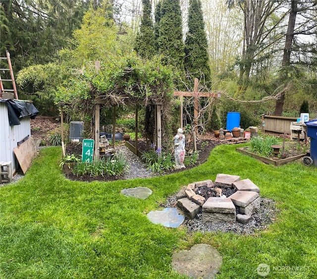 13118 Lost Lake Rd Unit 12, Snohomish, WA 98296 - view of grassy yard featuring an outdoor fire pit