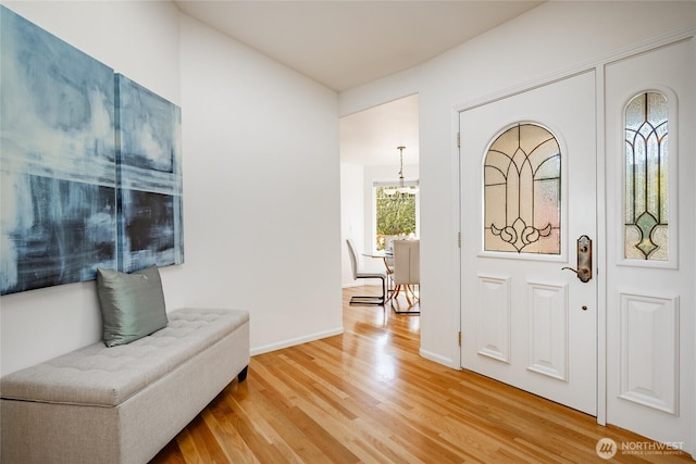 8012 Chinook Way, Blaine, WA 98230 - foyer featuring an inviting chandelier, baseboards, and light wood-type flooring