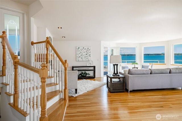 8012 Chinook Way, Blaine, WA 98230 - living room featuring a water view, baseboards, recessed lighting, and light wood finished floors