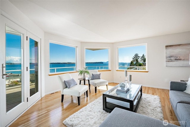 8012 Chinook Way, Blaine, WA 98230 - living room featuring light wood-style floors, baseboards, a water view, and visible vents
