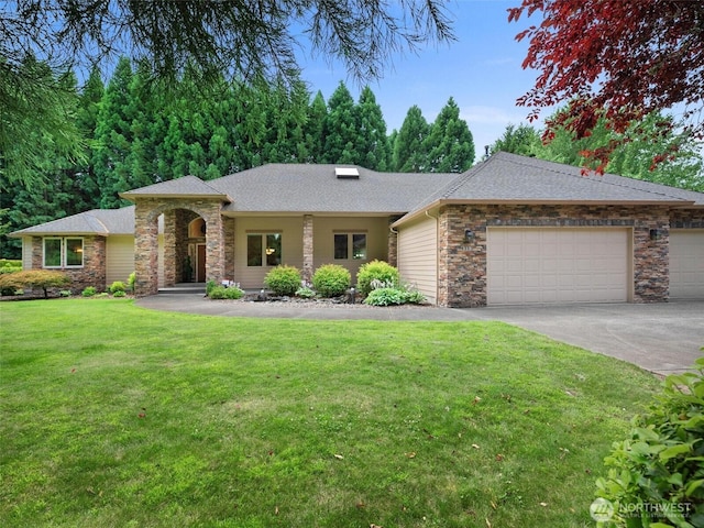 ranch-style home with a garage, a front yard, driveway, and stone siding