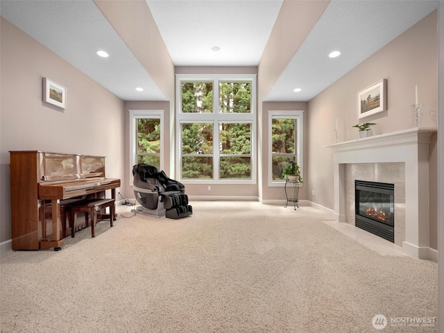 living area with recessed lighting, baseboards, carpet, and a fireplace