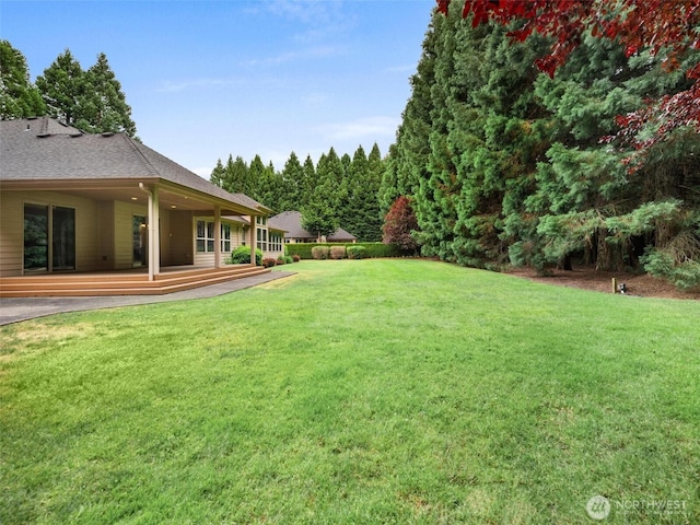view of yard featuring a deck