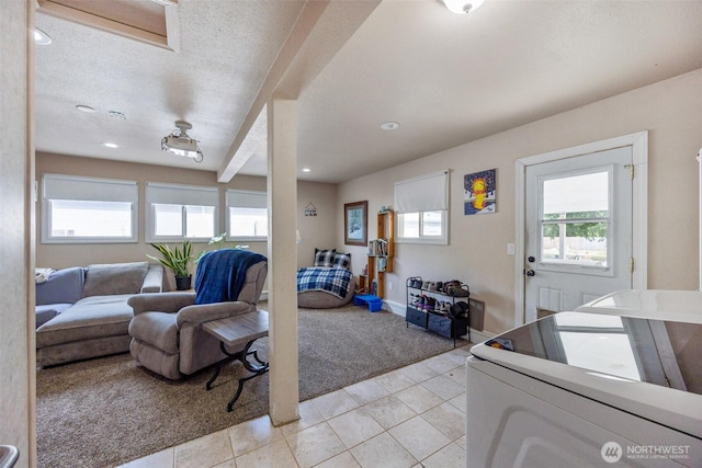 living room featuring a wealth of natural light, recessed lighting, light tile patterned flooring, and light carpet