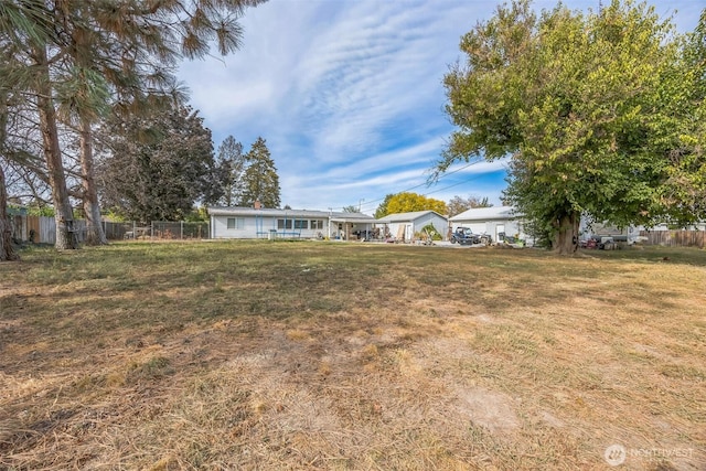 view of yard with fence