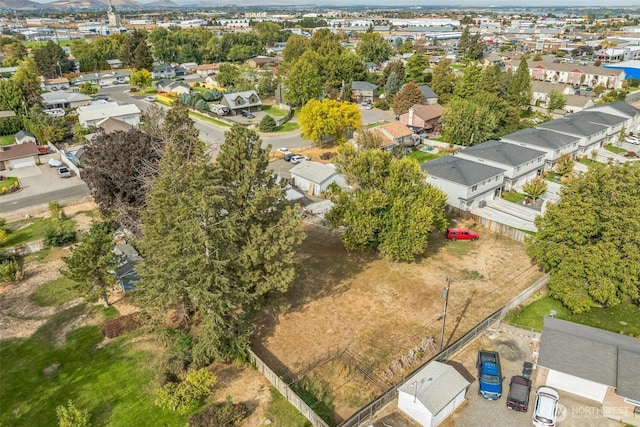 birds eye view of property with a residential view