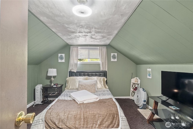 carpeted bedroom featuring lofted ceiling