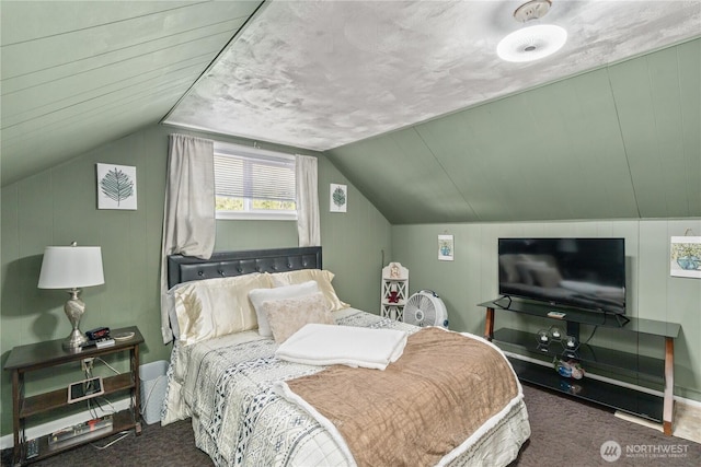 carpeted bedroom featuring lofted ceiling
