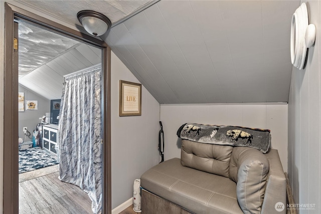 bedroom featuring vaulted ceiling and wood finished floors