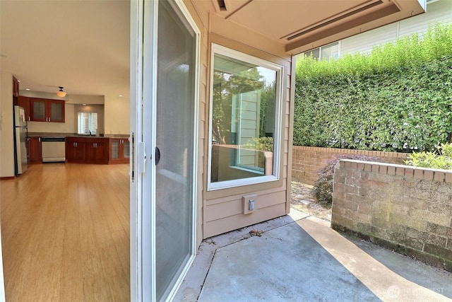 view of patio / terrace with fence and a sink