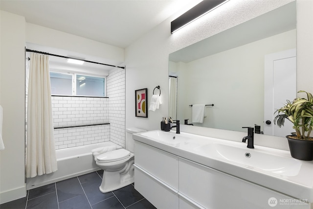 full bath with a sink, tile patterned flooring, toilet, and shower / tub combo with curtain