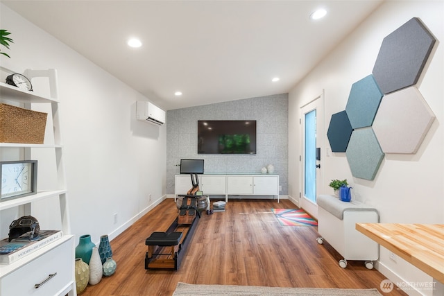 workout room featuring a wall mounted AC, wood finished floors, baseboards, an accent wall, and recessed lighting