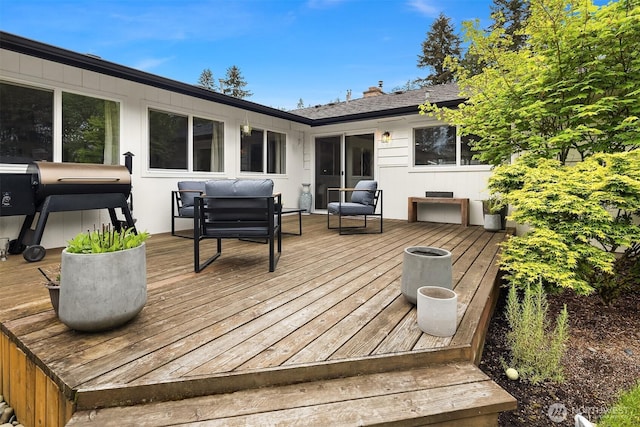wooden deck featuring grilling area