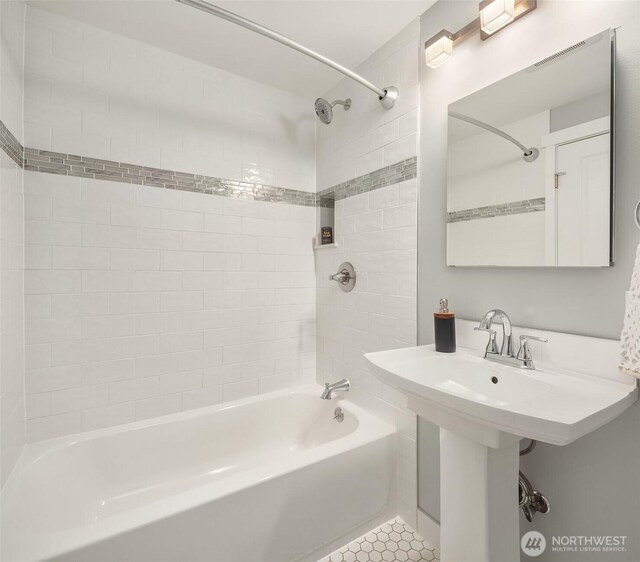 full bathroom featuring visible vents and  shower combination