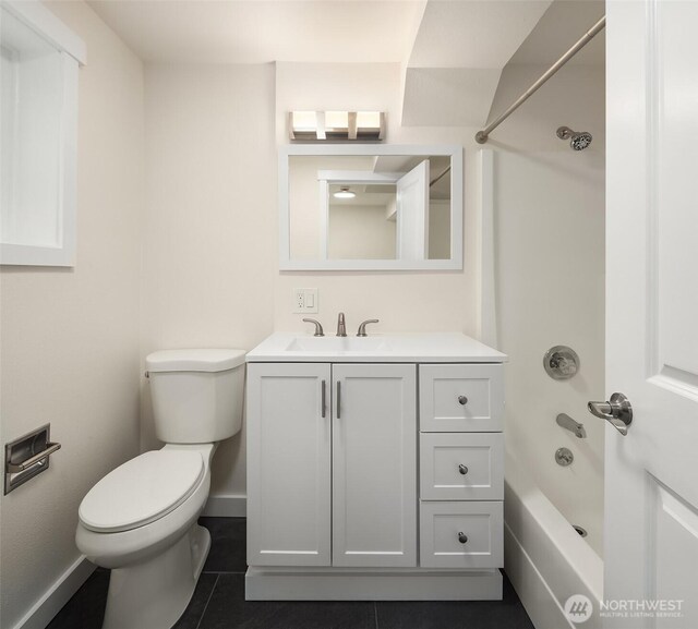 full bathroom featuring vanity, toilet, bathing tub / shower combination, baseboards, and tile patterned floors