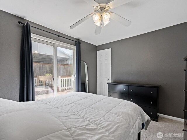 carpeted bedroom with baseboards, access to outside, and a ceiling fan