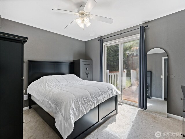 carpeted bedroom with baseboards, a ceiling fan, and access to exterior