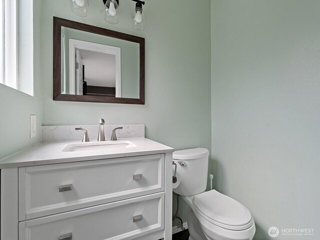 bathroom with vanity and toilet