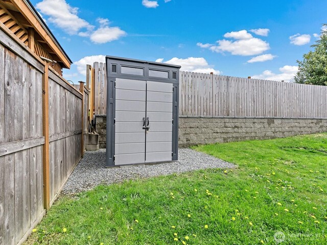 view of shed featuring a fenced backyard