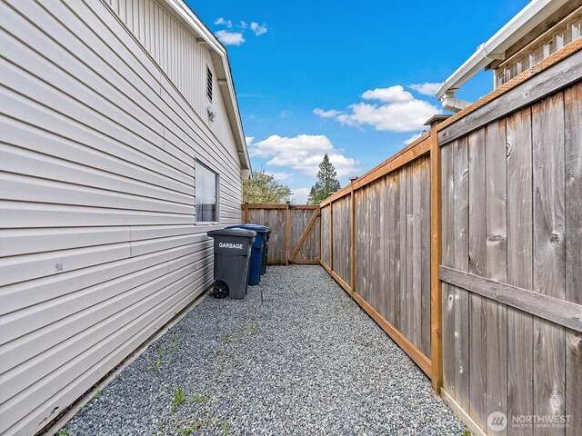 view of home's exterior with fence