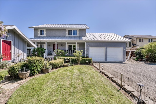135 NE Boad Haven Rd, Belfair, WA 98528 - traditional home with a garage, dirt driveway, a front yard, a standing seam roof, and covered porch
