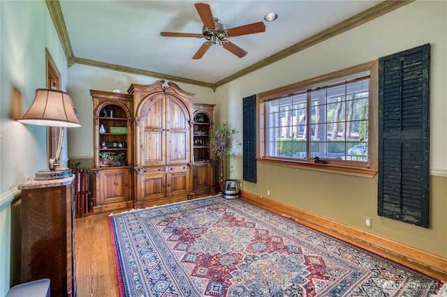 135 NE Boad Haven Rd, Belfair, WA 98528 - office area featuring light wood-type flooring, crown molding, a ceiling fan, and baseboards