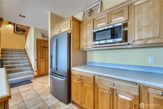 135 NE Boad Haven Rd, Belfair, WA 98528 - kitchen featuring appliances with stainless steel finishes, light countertops, and light tile patterned flooring