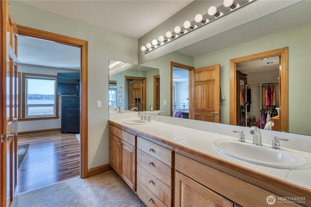 135 NE Boad Haven Rd, Belfair, WA 98528 - full bath featuring double vanity, baseboards, and a walk in closet