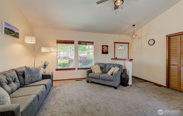 living area with a ceiling fan, carpet flooring, lofted ceiling, and baseboards