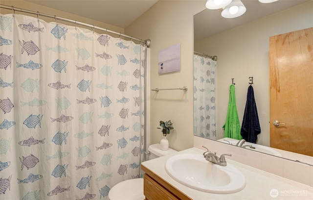 bathroom with vanity, toilet, and a shower with shower curtain