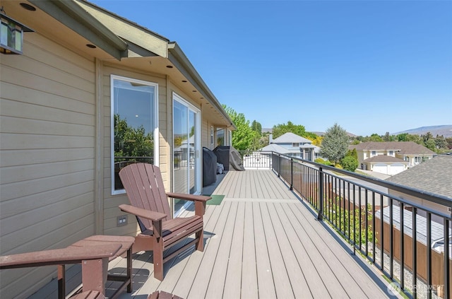 wooden deck with a residential view