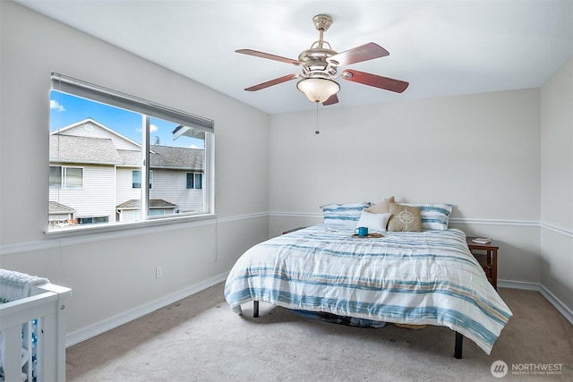 bedroom featuring carpet flooring, baseboards, and a ceiling fan