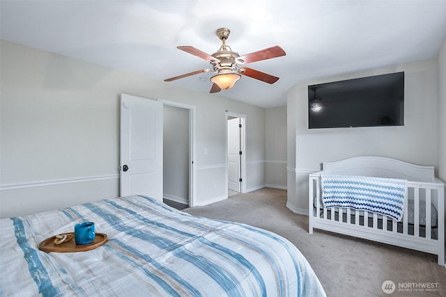 bedroom with carpet, baseboards, and a ceiling fan