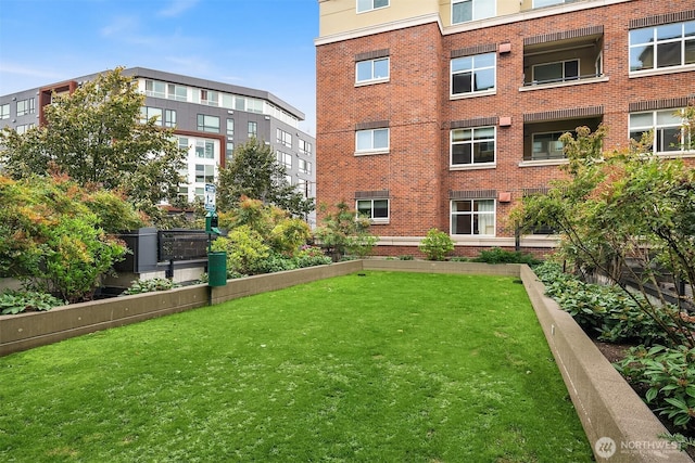 view of property's community with a yard